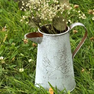graue Vase mit Vogelbild und Satz " Le Jardin aux Oiseaux"